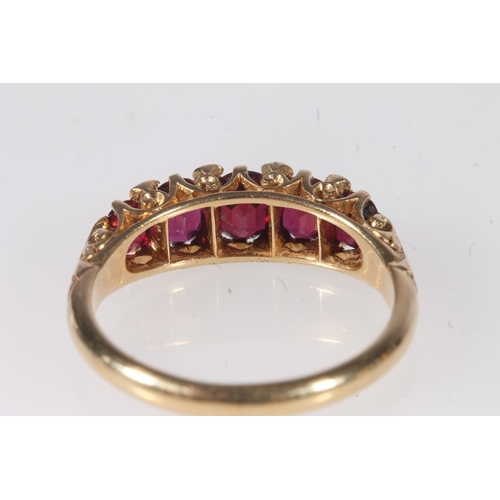 146 - 18ct gold ruby and diamond thirteen stone ring, makers mark 'AH&S' and stamped '18ct', ring size... 