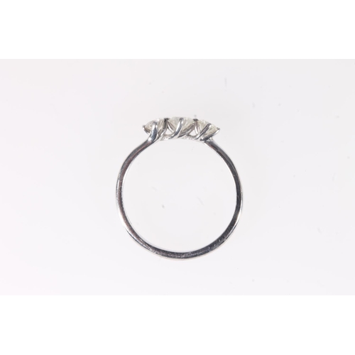 166 - 18ct white gold diamond three stone ring, the central 0.3ct diamond flanked by slightly smaller ston... 