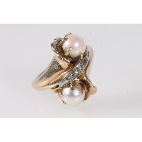 179 - 14ct yellow gold crossover ring set with two pearls and three small diamonds, stamped '14K', ring si... 