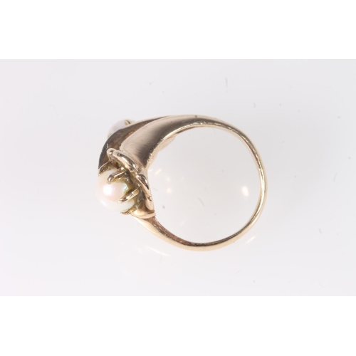 179 - 14ct yellow gold crossover ring set with two pearls and three small diamonds, stamped '14K', ring si... 