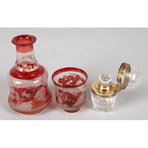 217 - Silver rimmed glass scent bottle illegibly marked continental, and a miniature decanter and glass wi... 