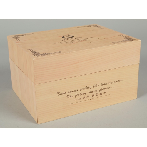 242 - Rhymer musical casket on scroll supports, in fitted box.