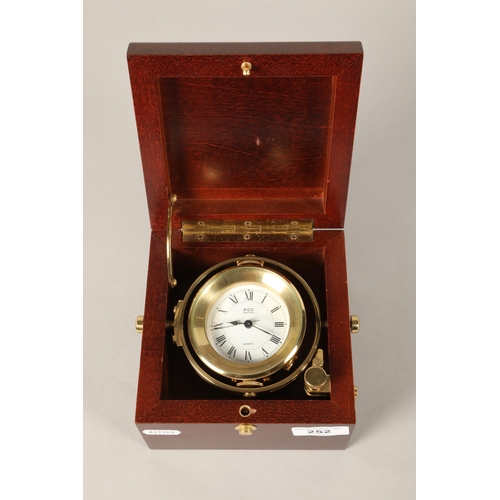 252 - FCC Pression brass gimble clock in mahogany case,