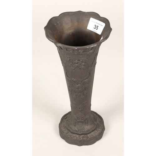 35 - Wedgewood black basalt vase decorated in relief with floral and leaf tendrils. 24cm