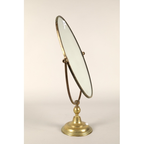 358 - Brass oval swing mirror.