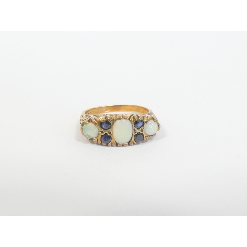 45 - 9ct gold opal and sapphire trilogy ring, London 1979, Size 'O', 5.1g