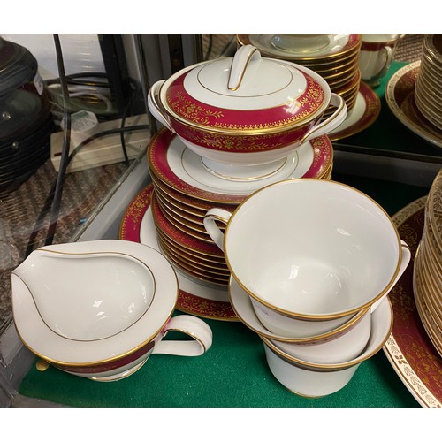 255 - Noritaki Goldmere teaset and a Crown Ducal gilt and burgundy decorated dinner service.