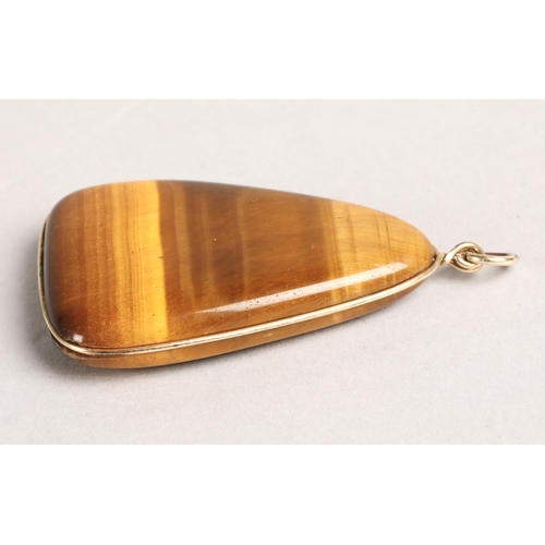 137 - Tigers Eye jewellery to include two pendants and two pairs of earrings (one pair screw-on), earrings... 