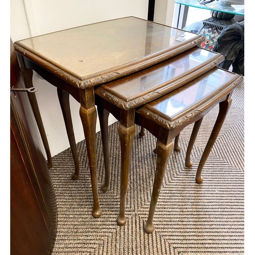 546 - Nest of three glass topped walnut side tables 