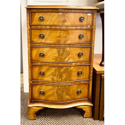 528 - Reproduction mahogany serpentine chest of five drawers.