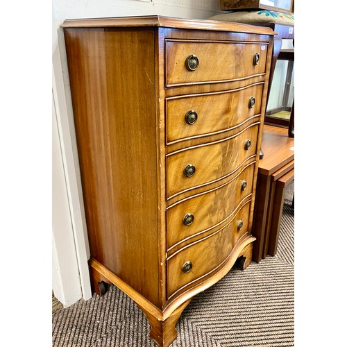 528 - Reproduction mahogany serpentine chest of five drawers.