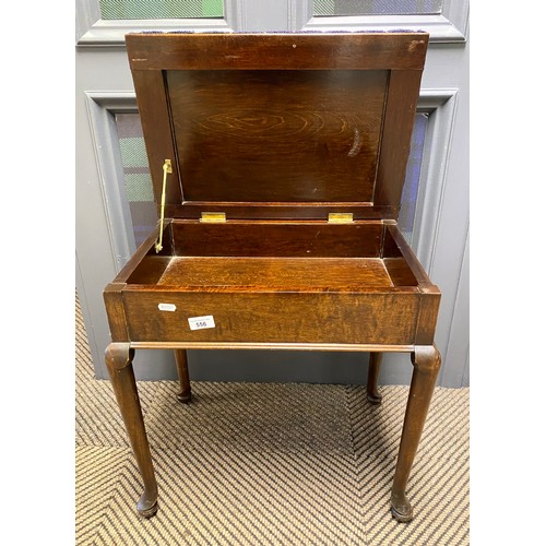 556 - Mahogany piano stool in floral upholstery, raised on cabriole legs 