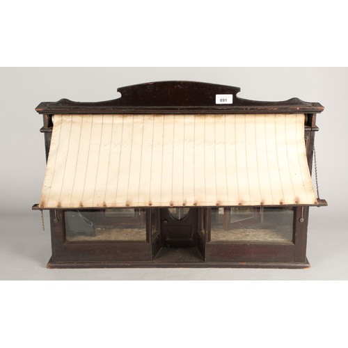 691 - Novelty antique shop front with carry handle and pull-out canopy, the back opens on two sides with s... 