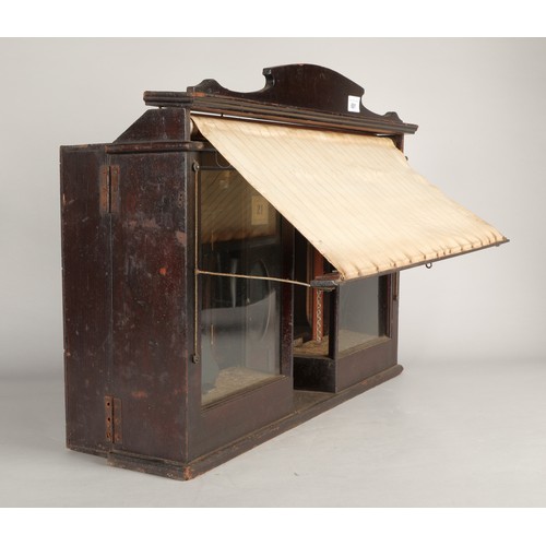 691 - Novelty antique shop front with carry handle and pull-out canopy, the back opens on two sides with s... 