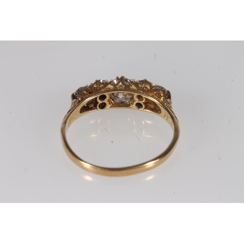 130 - Edwardian 18ct gold and seven diamond ring, the seven round cut graduating stones approximately 0.9 ... 