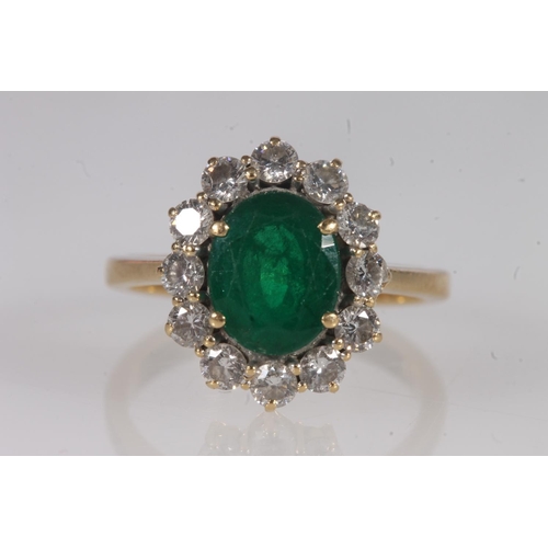 134 - 18ct gold, emerald and diamond cluster ring, the oval cut emerald within a halo of round cut diamond... 