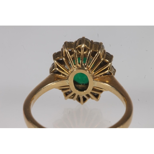 134 - 18ct gold, emerald and diamond cluster ring, the oval cut emerald within a halo of round cut diamond... 