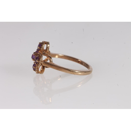 136 - Edwardian 9ct gold and amethyst ring, the five round cut amethysts prong set on a rope twist openwor... 