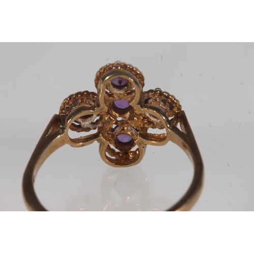 136 - Edwardian 9ct gold and amethyst ring, the five round cut amethysts prong set on a rope twist openwor... 