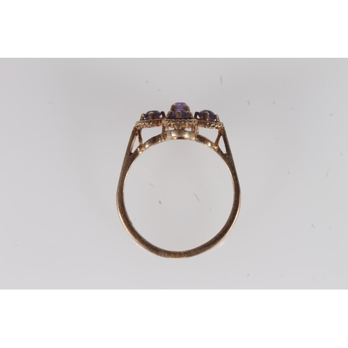 136 - Edwardian 9ct gold and amethyst ring, the five round cut amethysts prong set on a rope twist openwor... 