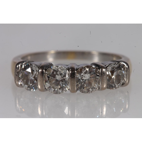 189 - 18ct gold and four stone diamond ring, the round cut brilliants bar set on a white gold mount, leadi... 