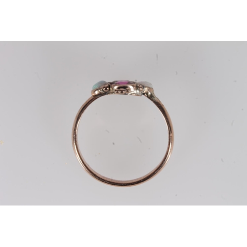 191 - Early 20th century yellow metal pink stone and opal ring, the oval cut pink stones flanked by caboch... 