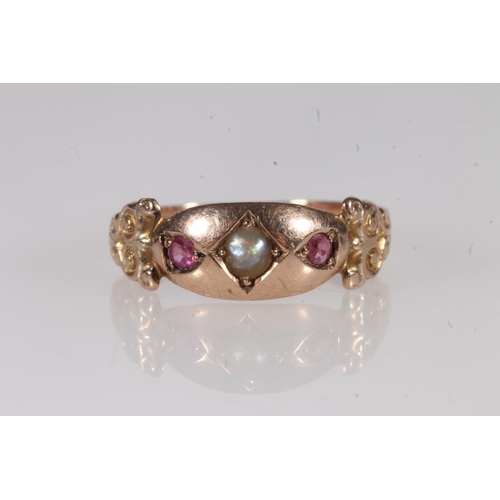 192 - Edwardian 9ct gold seed pearl and ruby ring, the split pearl flanked by two round cut rubies in a pr... 