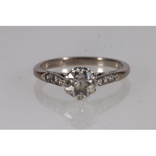 198 - 18ct gold and diamond solitaire ring, the round cut brilliant prong set on a platinum cathedral moun... 