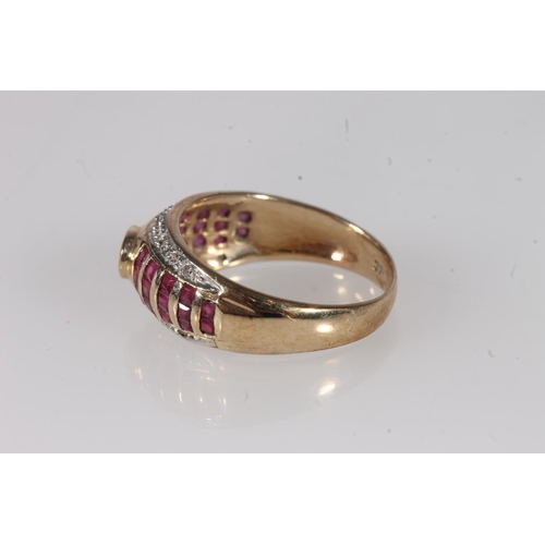 200 - 9ct gold ruby and diamond ring, the bezel set central oval ruby flanked by interspersed ruby bands a... 