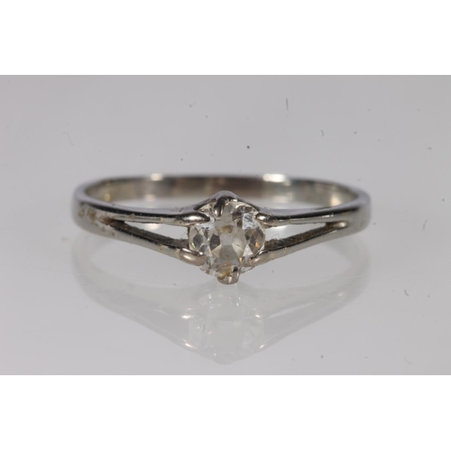 202 - Diamond solitaire ring, the round brilliant on a split white metal shank, diamond weight approximate... 