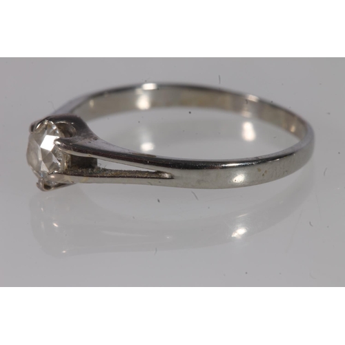 202 - Diamond solitaire ring, the round brilliant on a split white metal shank, diamond weight approximate... 