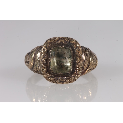 203 - Victorian yellow metal ring, the clear foil backed stone on a fancy engraved mount and conforming ta... 