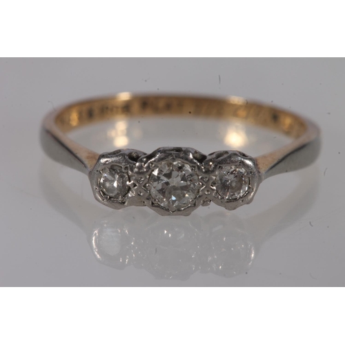 206 - 18ct gold diamond trilogy ring, the round cut graduated diamonds set on platinum shoulders leading t... 