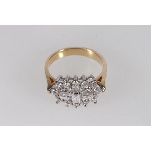 209 - 18ct gold and diamond cluster ring, the central baguette cut diamonds flanked by twelve individual r... 