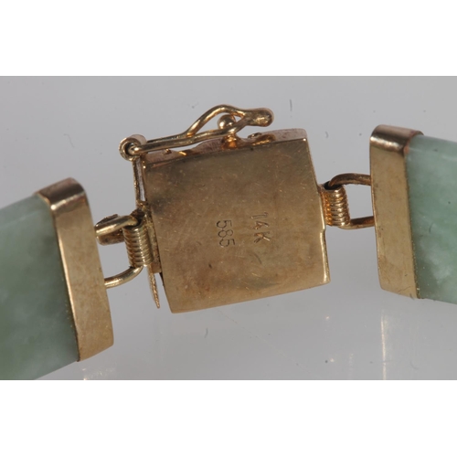 219 - Chinese 14ct gold and jade bangle, the jade segments linked by openwork gold dragons, total length 1... 