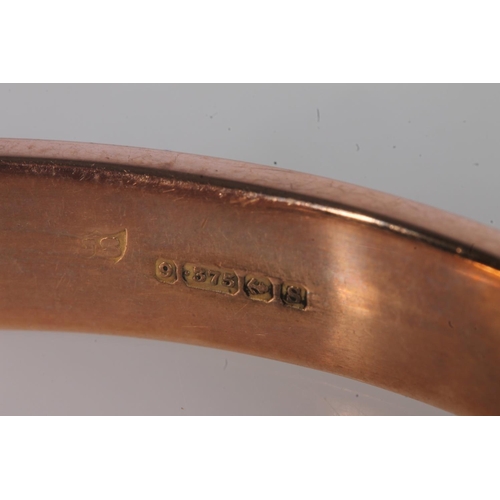 222 - Early 20th century 9ct rose gold half engraved bangle, 9.8g, internal width 6.4cm, in original box.