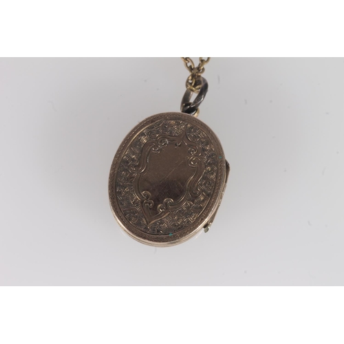 231 - Victorian yellow metal and hardstone locket pendant, on a base metal chain, locket 2.3cm high.