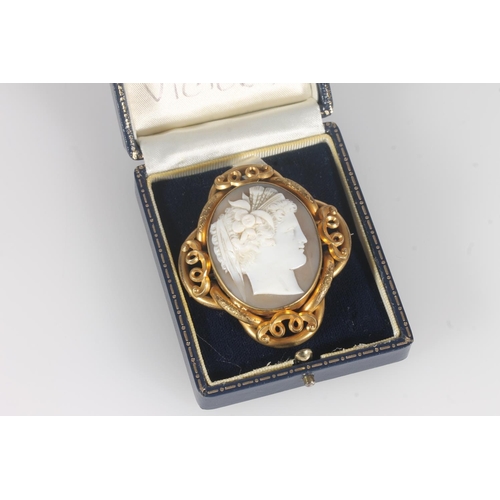 234 - Victorian cameo brooch, the shell cameo with typical classical maiden bust, withing a scrolled pinch... 