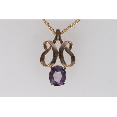 237 - Amethyst and yellow metal pendant, the openwork scroll frame above an oval amethyst, on fine 9ct gol... 