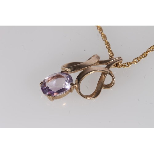 237 - Amethyst and yellow metal pendant, the openwork scroll frame above an oval amethyst, on fine 9ct gol... 