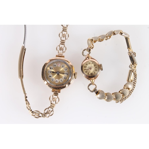 257 - 9ct gold lady's wristwatch head on metal strap, together with a Invicta cocktail watch.