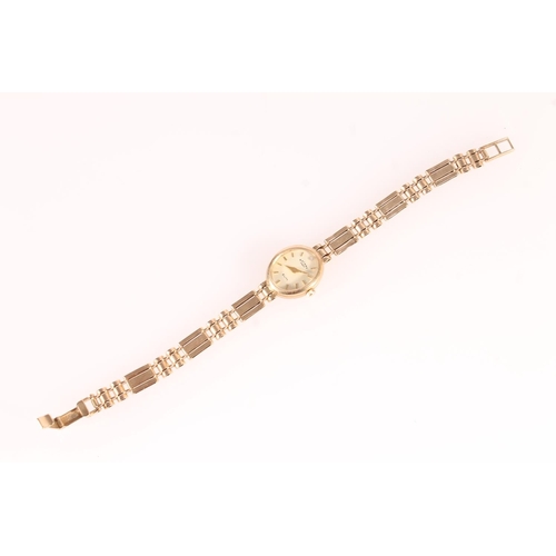 260 - Rotary Elite 9ct gold lady's cocktail watch, the oval cream dial with baton markers and diamond at 1... 