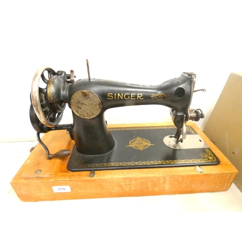 378 - Cased Singer sewing machine.