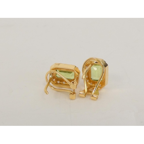 29 - Pair of peridot and diamond rectangular cluster ear studs in gold '.750'. 