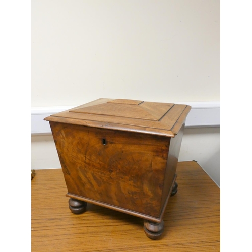 403 - 19th century mahogany cellarette of square sarcophagus form raised on turned bun feet. Height 43cm, ... 