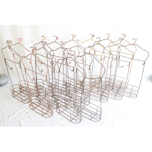 624 - Set of eighteen vintage wrought metal swimming baths changing hanger racks, each stamped with changi... 