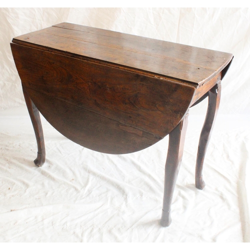 631 - 18th century oak drop leaf table, the cabriole legs terminating in carved feet, H75cm.