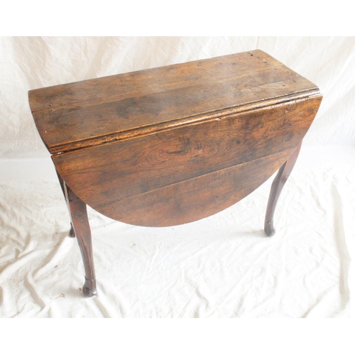 631 - 18th century oak drop leaf table, the cabriole legs terminating in carved feet, H75cm.