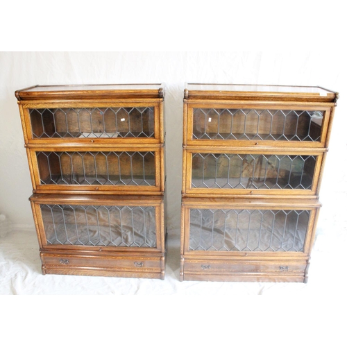 632 - Pair of Globe Wernicke oak sectional bookcases, early 20th century, with astragal glazed fronts and ... 