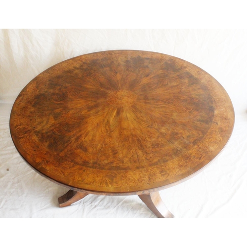 633 - Victorian walnut loo table of round shape over a tripartite base.   W121cm, H82cm.